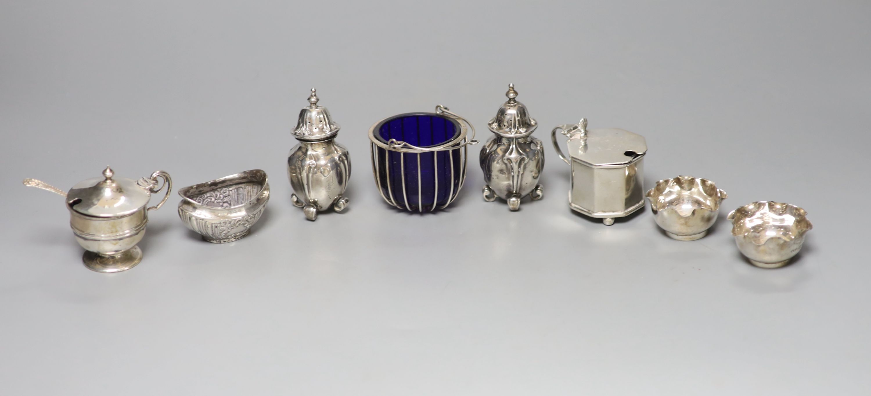 Eight assorted 20th century silver condiments including two mustard pots.